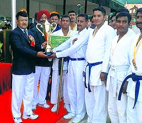 The North Frontier team with winners trophy in Mussoorie on Friday. 