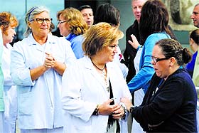 Health workers gather outside the Carlos III hospital in Madrid on Friday. 