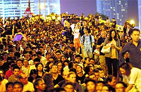 Pro-democracy protestors gather outside the government headquarters as they continue to block the area around the Central financial district in Hong Kong on Friday