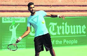 A player returns a shot during a match at the CLTA tennis courts on Saturday