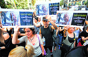People protest against the killing of Excalibur, the dog of Spanish nurse Teresa Romero, and the handling of the Ebola crisis, in Madrid on Saturday. 
