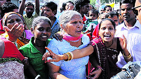 Sunday market vendors protest againt the Municipal Corporation officials at Amrik Singh Road on Sunday. 