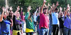 Students of the CCET flash the open hand symbol to mark the 127th birth anniversary of Le Corbusier at the Sector 17 Plaza in Chandigarh on Sunday