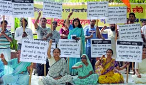 Activists of the Rashtriya Hindu Andolan shout slogans during a demonstration at Jantar Mantar, demanding a ban on the slaughter of cows in New Delhi on Sunday.