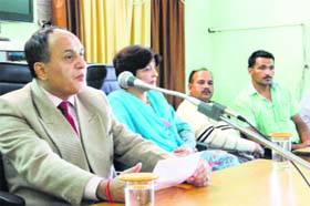 District and Sessions Judge RK Sharma addresses a legal literacy camp at Salooni in Chamba on Sunday