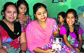 Harpreet Kaur, mother of the kidnapped child, Gurdeep Singh, in Jalandhar on Sunday. 