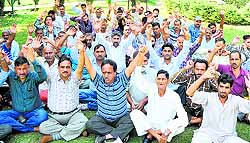 Members of the National Mazdoor Conference protest in Jammu on Sunday