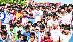 Virender Sehwag along with the students of Heritage School, Sainik Colony, Jammu, on Sunday