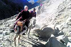 Member of Parliament Thupstan Chhewang on horseback on way to Rallay Eeching village in the Durbuk block of Leh district