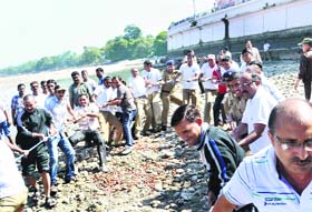Uttarakhand Police personnel and Shantikunj volunteers clean a Ganga ghat in Haridwar on Sunday