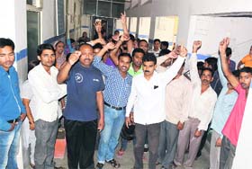 People protest at the Doon Hospital following death of newborns in Dehradun on Sunday