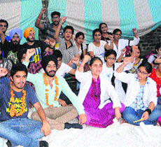 Students of Chintpurni Medical College sit on a chain hunger strike in Amritsar on Monday.