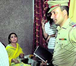 One of the family members narrates the robbery incident; and the police look for clues near the house in Phase X, Mohali, on Monday. 