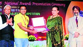 Nityashish Bhandari being honoured at a function. 