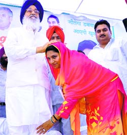 Punjab CM Parkash Singh Badal with INLD nominee Naina Singh Chautala at Dabwali on Monday.