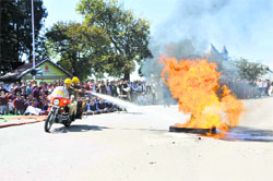 Firefighters extinguish a fire during a mock drill on International Day for Disaster Reduction on The Ridge in Shimla on Monday. Photo: Amit Kanwar