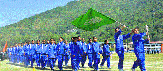 A team takes part in a marchpast at the 13th state-level women sports meet at the Paddal ground in Mandi on Monday. Photo: Jai Kumar