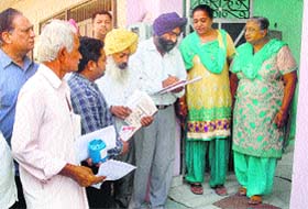 Health Department officials distribute chlorine tablets in the Sant Nagar area of Jalandhar after jaundice outbreak