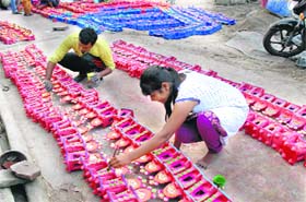 For Diwali: A potter prepares small clay temples that are specially used for Diwal rituals  in Jalandhar on Sunday. Diwali is to be celebrated on October 23