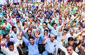 Members of the Water Works (PHE) Employees Association protest in Jammu on Monday. 