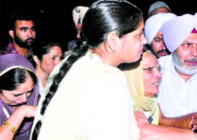 Grieving relatives of the police officer in Patiala