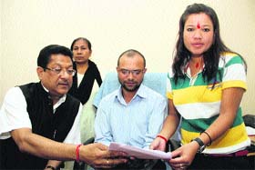 Jay Rana, Regional Planning Officer hands over an appointment letter to Pinky Rana, sister of armyman Manjo Rana, who died fighting terrorists in J&K