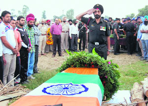 Last respects being paid to Gursahib Singh at Bhakna Kalan village near Attari on Tuesday.