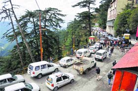 Vehicles in a long queue during a chakka jam by activists of the Chhatra Ekta Manch in Shimla on Tuesday
