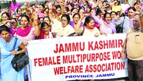 Members of the J&K Female Multipurpose Health Workers Welfare Association protest in Jammu on Tuesday.