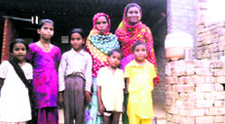 Veerpal Kaur with her six daughters in Bathinda. Tribune photo