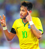 Neymar celebrates after scoring a hat-trick against Japan during their friendly match in Singapore. REUTERS