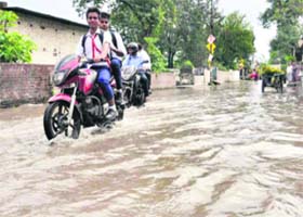 A waterlogged street after heavy rainfall in Dehradun on Tuesday