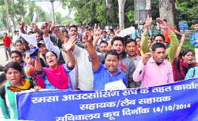Contractual teachers protest in support of their demands outside the Secretariat in Dehradun on Tuesday