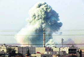 Smoke rises after US-led coalition bombed areas of Kobani, near the Turkey-Syria border, on Tuesday