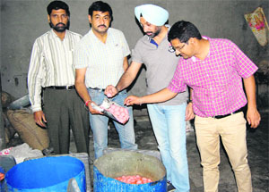 Dr Shivcharan Kahlon, district health officer, along with other members of his team inspects the sweets during the raid in Amritsar on Wednesday.