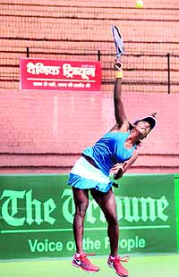 Nithyaraj Baburaj in action during a quarterfinal match of The Tribune Cup at the CLTA courts in Sector 10, Chandigarh, on Wednesday