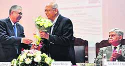 PU VC AK Grover (left) welcomes Prof Srikumar Banerjee, DAE Homi Bhabha Chair Professor, Bhabha Atomic Research Centre, Mumbai, at the Law Auditorium, PU, in Chandigarh on Wednesday. A former Chief of Army Staff, Gen VP Malik (retd), is also seen