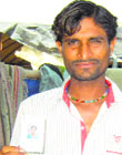 Raj Kumar shows his voters card. A Tribune photograph