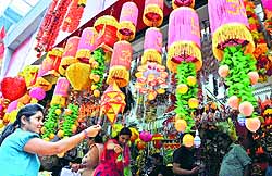 Festival shopping: A girl purchases decorative lamps ahead of Diwali in Jammu