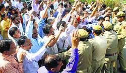 Members of the Jammu and Kashmir Teachers Forum protest in Jammu on Wednesday