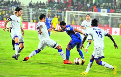 Chennaiyin (in white) and FC Goa players in action during their ISL match in Fatorda, Goa, on Wednesday