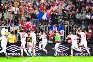  Albanias players run for cover after a brawl breaks out during their match against Serbia in Belgrade