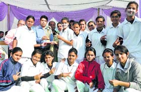 Players of DAV PG College celebrate after winning the Inter College Cricket Tournament at the Maharana Pratap Sports Stadium in Dehradun on Wednesday