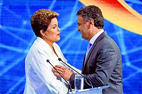 Brazils President Dilma Rousseff (L) greets Aecio Neves, both presidential candidates, at the end of a debate in Sao Paulo. 