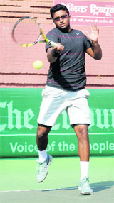 Mohit Mayur returns a shot during a semifinal match at the CLTA courts in Sector 10, Chandigarh, on Thursday