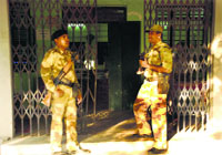 Guards outside a strongroom at the Bell Colony in Panchkula