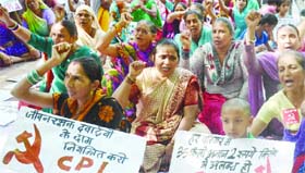 CPI activists protest rise in price of essential commodities and medicines, at Jantar Mantar in New Delhi on Thursday.