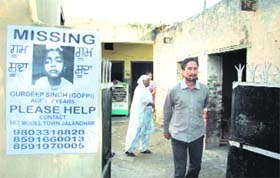 Kin of the kidnapped boy Gopi have pasted his posters outside his house in the Model Town locality in Jalandhar