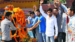 Youths pay tributes to student martyrs of 1966 on their martyrdom day at Shaheedi Sthal in GGM Science College, Jammu, on Thursday. Tribune photo: Inderjeet Singh