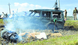 Army personnel at the blast site in Chakla village in Baramulla district on Thursday. Tribune photo: Amin War